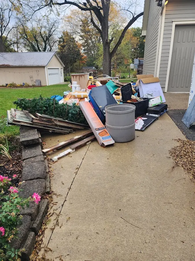 Dumpster being loaded with debris for Residential Dumpster Rental in Townsend